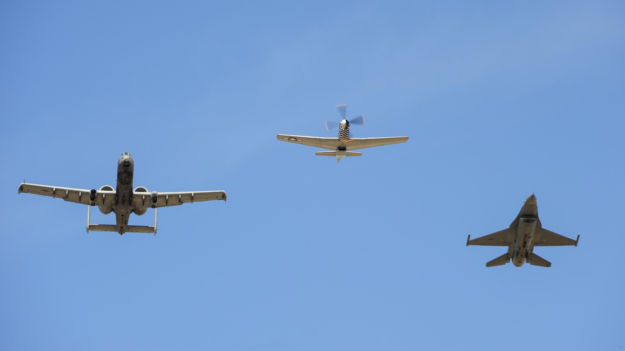 A U.S. Air Force A-10C Thunderbolt II, a P-51 Mustang and an F-16 Fighting Falcon fly in formation during the 2017 Heritage Flight Training and Certification Course at Davis-Monthan Air Force Base, Ariz., Feb. 10, 2017. The annual aerial demonstration training event has been held at D-M since 2001 and features aerial demonstrations from historical and modern fighter aircraft. (U.S. Air Force Photo by Airman 1st Class Nathan H. Barbour)