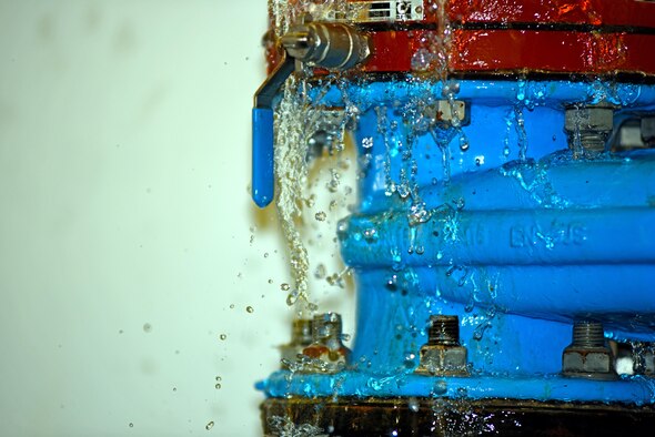 Water seeps from a pipe loosened by U.S. Air Force Airmen with the 379th Expeditionary Civil Engineer Squadron water and fuels section at Al Udeid Air Base, Qatar, Feb. 9, 2017. Just one pump house at Al Udeid can store upwards of 800,000 gallons of water.  (U.S. Air Force photo by Senior Airman Cynthia A. Innocenti)