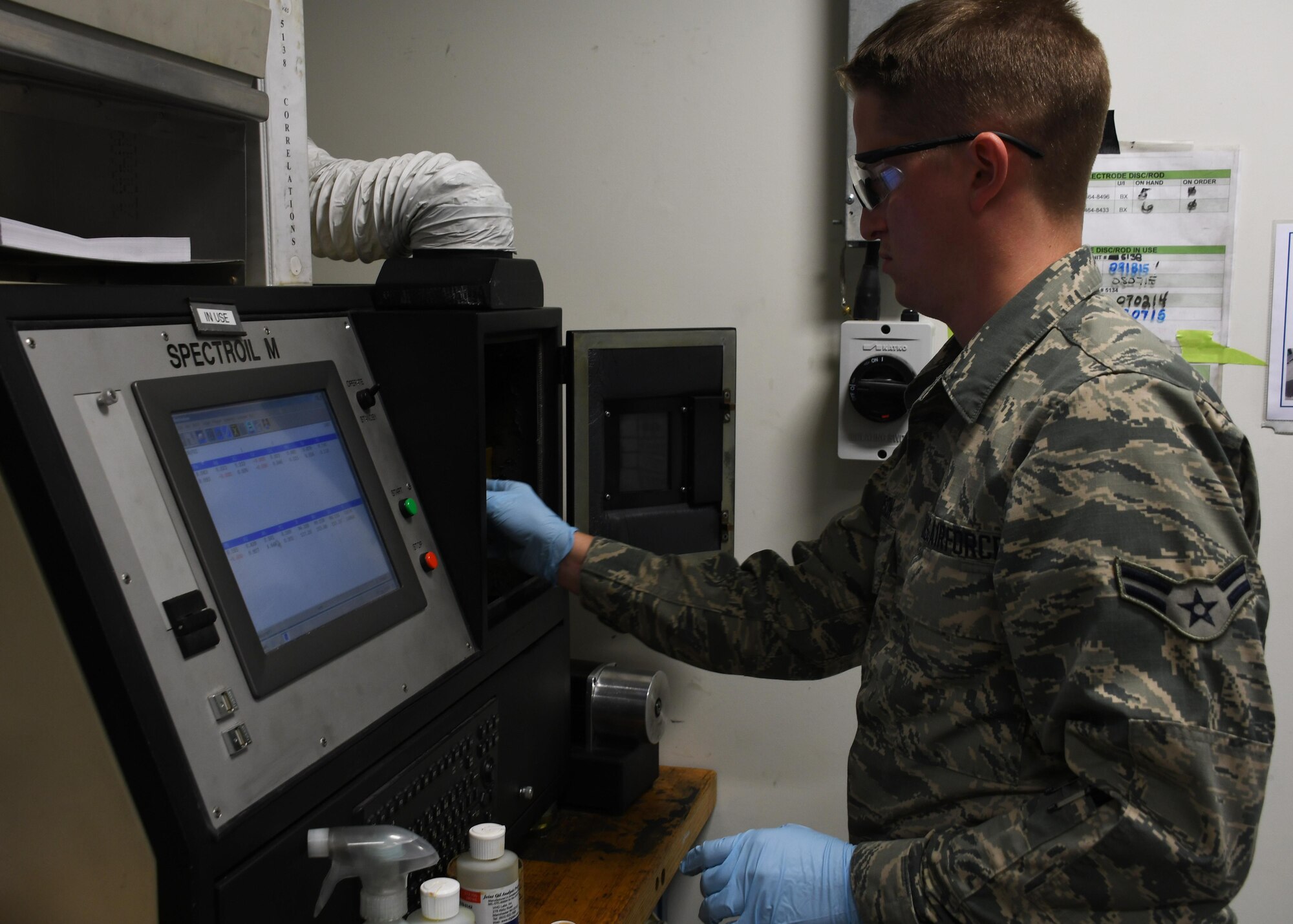 U.S. Air Force Airman 1st Class Travis Nevison, a non-destructive inspection journeyman with the 379th Expeditionary Maintenance Squadron Fabrication Flight, prepares to burn a test oil sample at Al Udeid Air Base, Qatar, Feb. 9, 2017. The joint oil analysis program utilizes oil samples gathered from aircraft to determine the wear and tear on internal parts of the engine without having to break it down completely.  (U.S. Air Force photo by Senior Airman Miles Wilson)