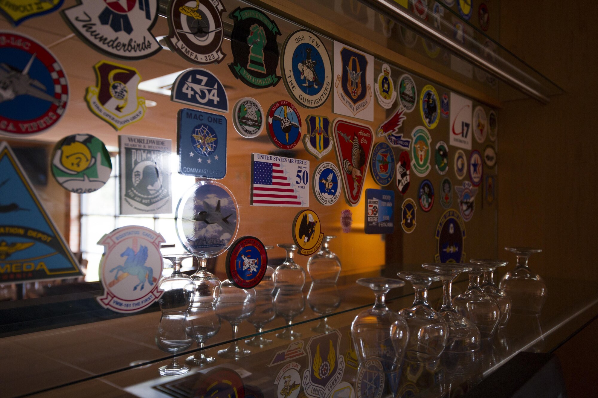 Customers get lunch from the grill located inside the McChord Field Club on Joint Base Lewis-McChord, Feb. 10. The newly renovated McChord Pub is now open inside the club on UTA Saturdays from 1600 to 2100, as well as Thursdays and Fridays. The pub will provide Citizen Airmen with alternative dining options and a place to order drinks during UTA weekends. (U.S. Air Force photo by SSgt. Daniel Liddicoet)