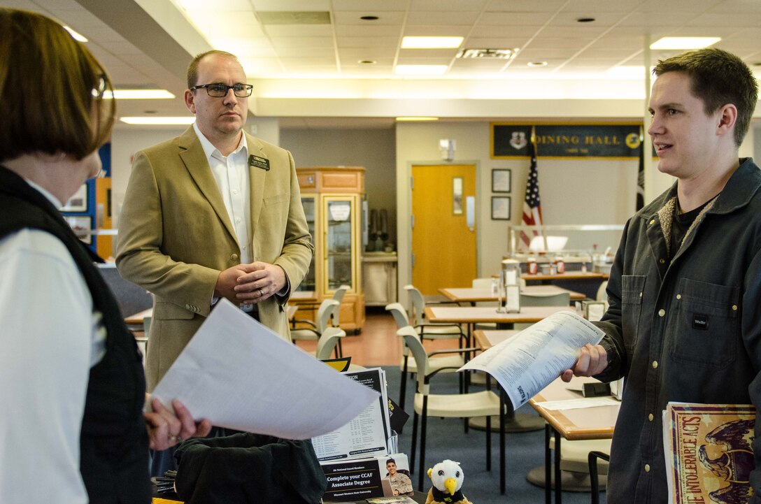 Representatives from Missouri Western State University discuss educational options with Airmen who are seeking a degree with the Community College of the Air Force, at Rosecrans Air National Guard Base, St. Joseph, Mo., Feb. 11, 2016. (U.S. Air National Guard photo by Airman 1st Class Audrey Chappell)