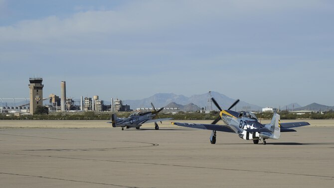 A P-51 Mustang and a P-40 Warhawk prepare to take off during the 2017 Heritage Flight Training and Certification Course at Davis-Monthan Air Force Base, Ariz., Feb. 10, 2017. Established in 1997, the HFTCC certifies civilian pilots of historic military aircraft and U.S. Air Force pilots to fly in formation together during the upcoming air show season. (U.S. Air Force photo by Airman 1st Class Mya M. Crosby)