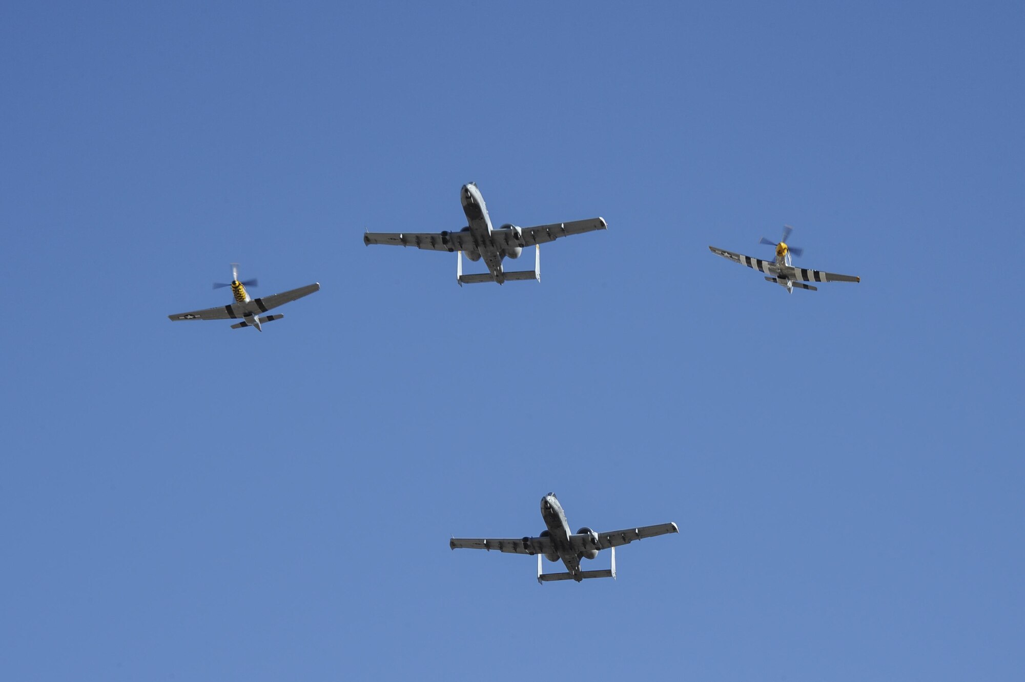 Two U.S. Air Force A-10C Thunderbolt IIs, a P-51 Mustang and a P-40 Warhawk fly in formation during the 2017 Heritage Flight Training and Certification Course at Davis-Monthan Air Force Base, Ariz., Feb. 10, 2017. Established in 1997, the HFTCC certifies civilian pilots of historic military aircraft and U.S. Air Force pilots to fly in formation together during the upcoming air show season. (U.S. Air Force photo by Airman 1st Class Mya M. Crosby)