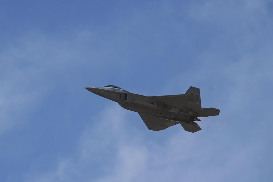 A U.S. Air Force F-22 Raptor flies during the 2017 Heritage Flight Training and Certification Course at Davis-Monthan Air Force Base, Ariz., Feb. 10, 2017. Established in 1997, the HFTCC certifies civilian pilots of historic military aircraft and U.S. Air Force pilots to fly in formation together during the upcoming air show season. (U.S. Air Force photo by Airman 1st Class Mya M. Crosby)