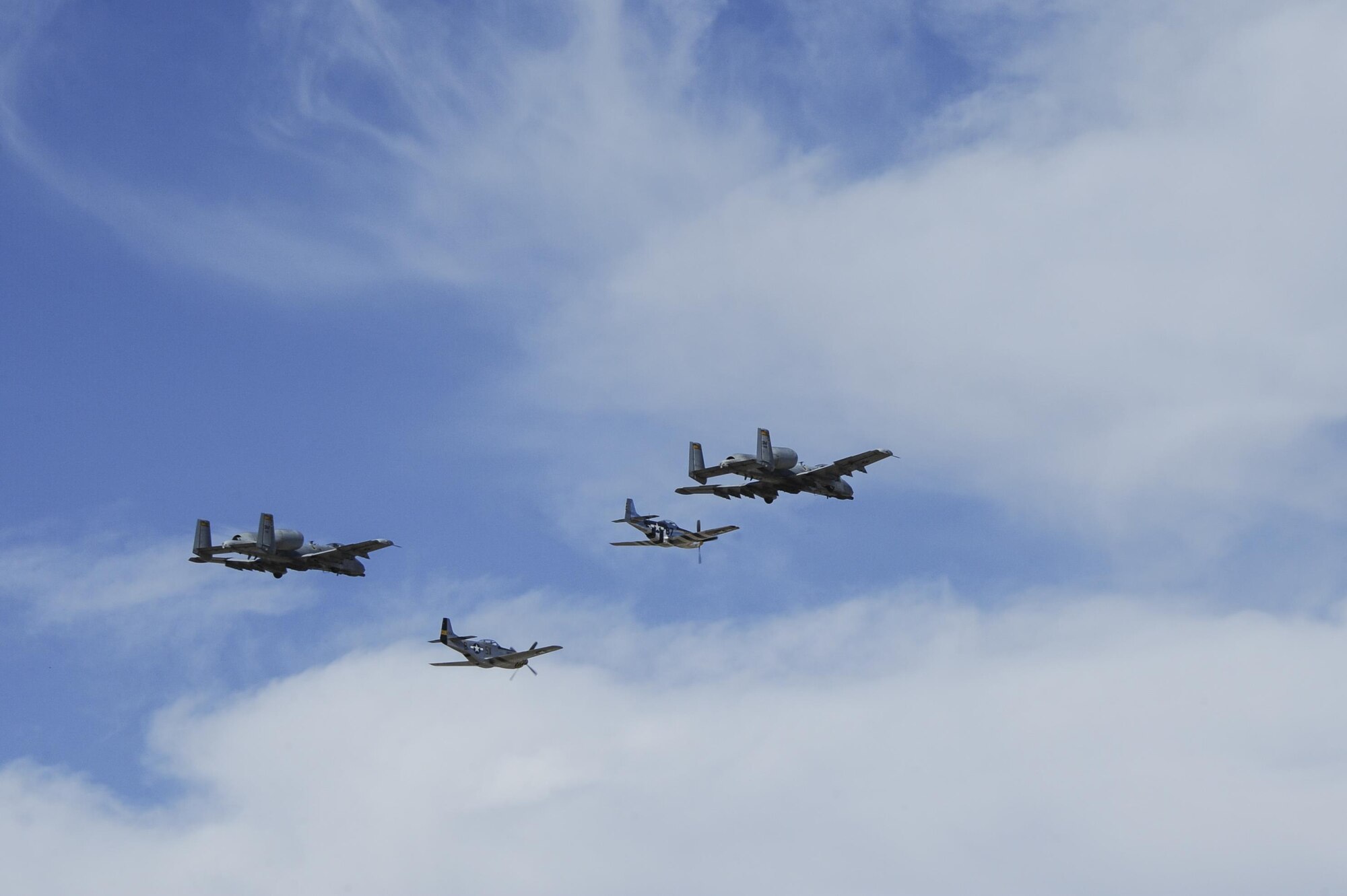 Two U.S. Air Force A-10C Thunderbolt IIs, a P-51 Mustang and a P-40 Warhawk fly in formation during the 2017 Heritage Flight Training and Certification Course at Davis-Monthan Air Force Base, Ariz., Feb. 10, 2017. Established in 1997, the HFTCC certifies civilian pilots of historic military aircraft and U.S. Air Force pilots to fly in formation together during the upcoming air show season. (U.S. Air Force photo by Airman 1st Class Mya M. Crosby)