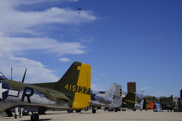 A U.S. Air Force F-22 Raptor, a F-86 Sabre and a P-51 Mustang fly in formation over historic aircraft during the 2017 Heritage Flight Training and Certification Course at Davis-Monthan Air Force Base, Ariz., Feb. 11, 2017. The modern aircraft that participated in this year’s HFTCC were the F-35 Lightning II, the F-22 Raptor, F-16 Fighting Falcon and the A-10C Thunderbolt II. The historic aircraft included the P-51 and T-51 Mustangs, the P-40 Warhawk, the P-38 Lightning, the P-47 Thunderbolt, the T-33 Shooting Star and the F-86 Sabre. (U.S. Air Force photo by Senior Airman Betty R. Chevalier)