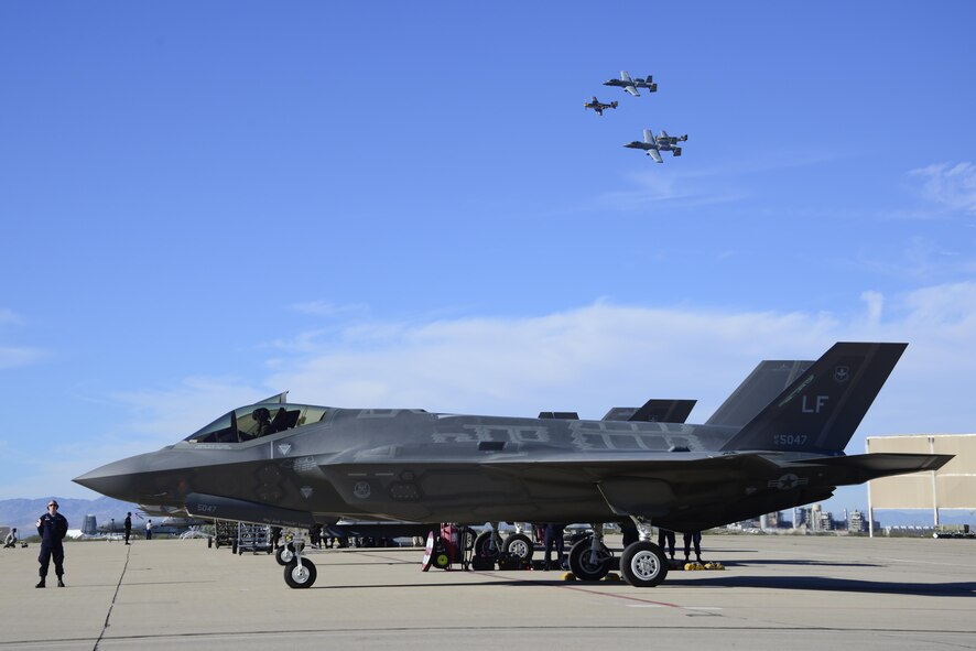 Two U.S. Air Force A-10C Thunderbolt II's and two P-51 Mustang's fly in formation over a F-35 Lightning II during the 2017 Heritage Flight Training and Certification Course at Davis-Monthan Air Force Base, Ariz., Feb. 11, 2017.  During the course, aircrews practice ground and flight training to enable civilian pilots of historic military aircraft and U.S. Air Force pilots of current fighter aircraft to fly safely in formations together. (U.S. Air Force photo by Senior Airman Betty R. Chevalier)