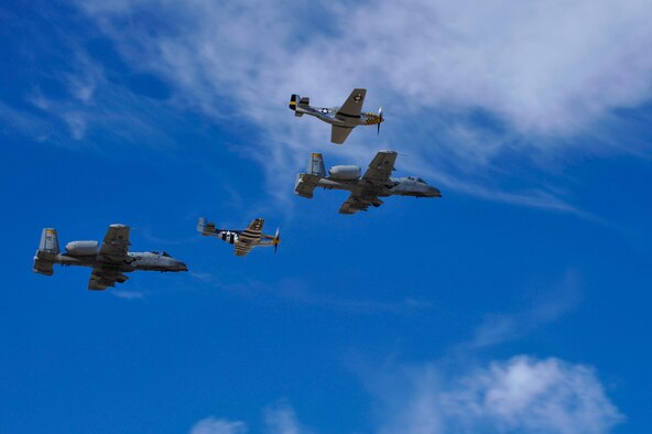Two U.S. Air Force A-10C Thunderbolt IIs and two P-51 Mustangs perform a flyover during the 2017 Heritage Flight Training and Certification Course at Davis-Monthan Air Force Base, Ariz., Feb. 11, 2017. The HFTCC provides civilian and military pilots the opportunity to practice flying in formation together in preparation for future air shows. (U.S. Air Force photo by Senior Airman Cheyenne A. Powers)