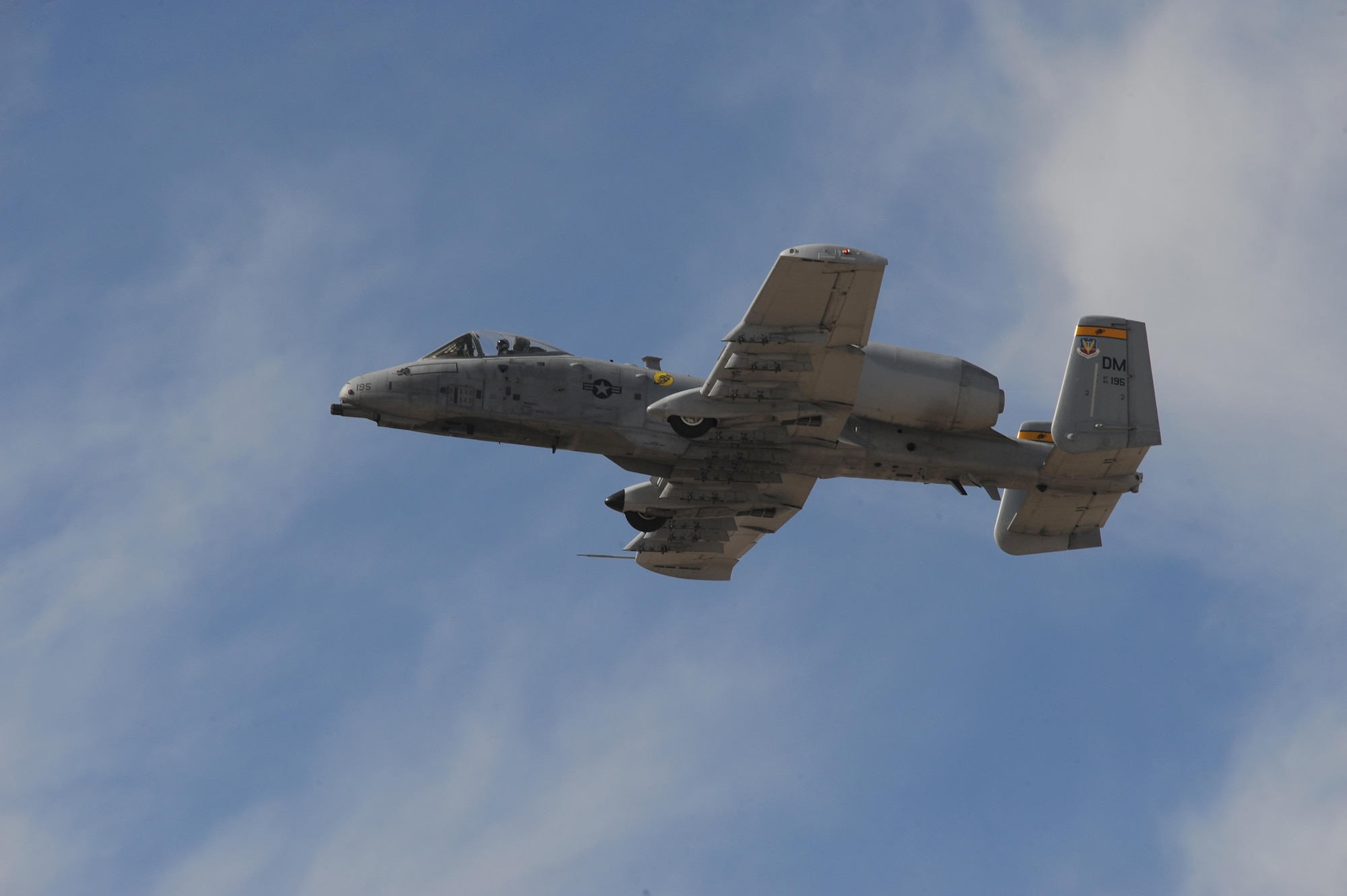 A U.S. Air Force A-10C Thunderbolt II flies above spectators during the 2017 Heritage Flight Training and Certification Course at Davis-Monthan Air Force Base, Ariz., Feb. 11, 2017. The modern aircraft that participated in this year's HFTCC were the F-35 Lightning II, the F-22 Raptor, F-16 Fighting Falcon and the A-10C Thunderbolt II. The historic aircraft included the P-51 and T-51 Mustangs, the P-40 Warhawk, the P-38 Lightning, the P-47 Thunderbolt, the T-33 Shooting Star and the F-86 Sabre. (U.S. Air Force photo by Senior Airman Ashley N. Steffen)
