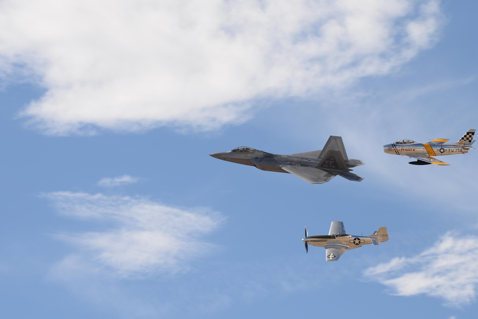 An F-35 Lightning II, a P-47 Thunderbolt and a P-38 Lightning perform a fly over during the 2017 Heritage Flight Training and Certification Course at Davis-Monthan Air Force Base, Ariz., Feb. 11, 2017. The annual aerial demonstration training event has been held at D-M since 2001. (U.S. Air Force photo by Senior Airman Ashley N. Steffen)