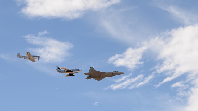 An F-35 Lightning II, a P-47 Thunderbolt and a P-38 Lightning perform a fly over during the 2017 Heritage Flight Training and Certification Course at Davis-Monthan Air Force Base, Ariz., Feb. 11, 2017. Established in 1997, the HFTCC certifies civilian pilots of historic military aircraft and U.S. Air Force pilots to fly in formation together during the upcoming air show season. (U.S. Air Force photo by Senior Airman Ashley N. Steffen)