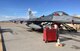 Crew chiefs with the 115th Fighter Wing perform routine inspections on an F-16 Fighting Falcon. 