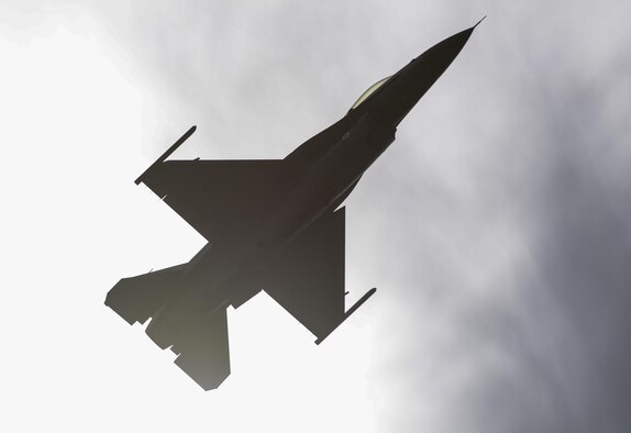 A U.S. Air Force F-16 Fighting Falcon performs during the 2017 Heritage Flight Training and Certification Course at Davis-Monthan Air Force Base, Ariz., Feb. 11, 2017. Established in 1997, the HFTCC certifies civilian pilots of historic military aircraft and U.S. Air Force pilots to fly in formation together during the upcoming air show season. (U.S. Air Force Photo by Airman 1st Class Nathan H. Barbour)