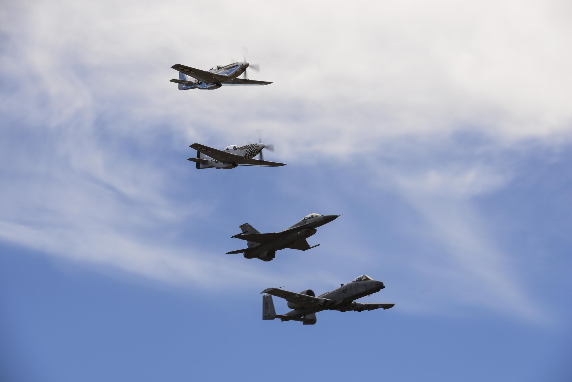 A U.S. Air Force A-10C Thunderbolt II, F-16 Fighting Falcon, TF-51  and  P-51 Mustang  fly in formation during the 2017 Heritage Flight Training and Certification Course at Davis-Monthan Air Force Base, Ariz., Feb. 11, 2017. During the course, aircrews practice ground and flight training to enable civilian pilots of historic military aircraft and U.S. Air Force pilots of current fighter aircraft to safely fly in formations together. (U.S. Air Force Photo by Airman 1st Class Nathan H. Barbour)