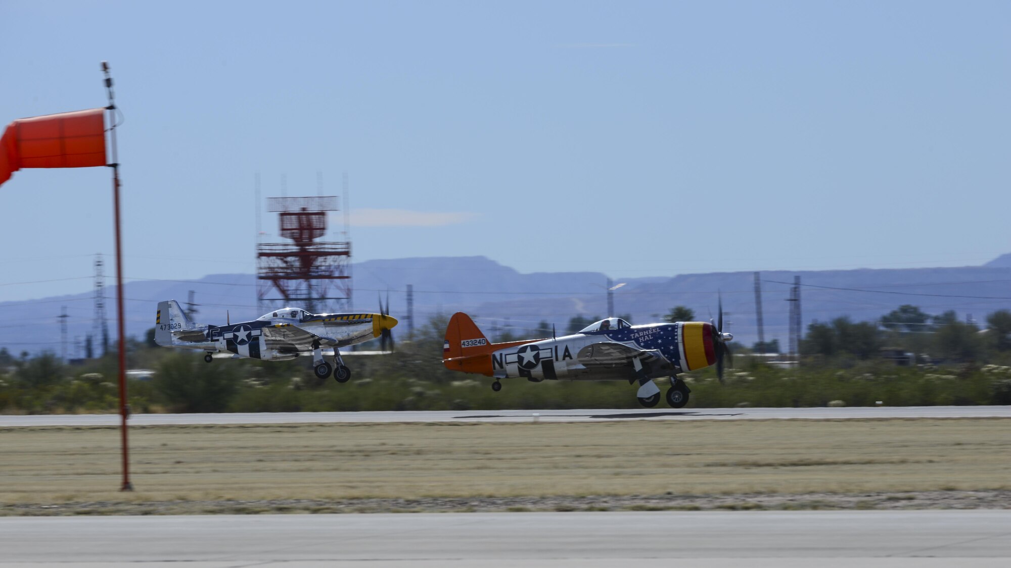 A P-51 Mustang and a P-47 Thunderbolt take off during the 2017 Heritage Flight Training and Certification Course at Davis-Monthan Air Force Base, Ariz., Feb. 11, 2017. The annual aerial demonstration training event has been held at D-M since 2001 and featured aerial demonstrations from historical and modern fighter aircraft. (U.S. Air Force Photo by Airman 1st Class Nathan H. Barbour)