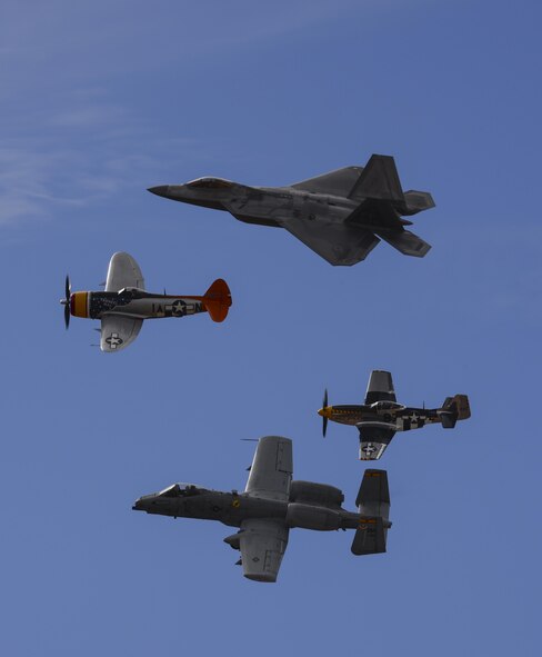 A U.S. Air Force F-22 Raptor, P-47 Thunderbolt, P-51 Mustang and an A-10C Thunderbolt II fly in formation during the 2017 Heritage Flight Training and Certification Course at Davis-Monthan Air Force Base, Ariz., Feb. 11, 2017. The HFTCC provides civilian and military pilots the opportunity to practice flying in formation together in preparation for future air shows. (U.S. Air Force Photo by Airman 1st Class Nathan H. Barbour)