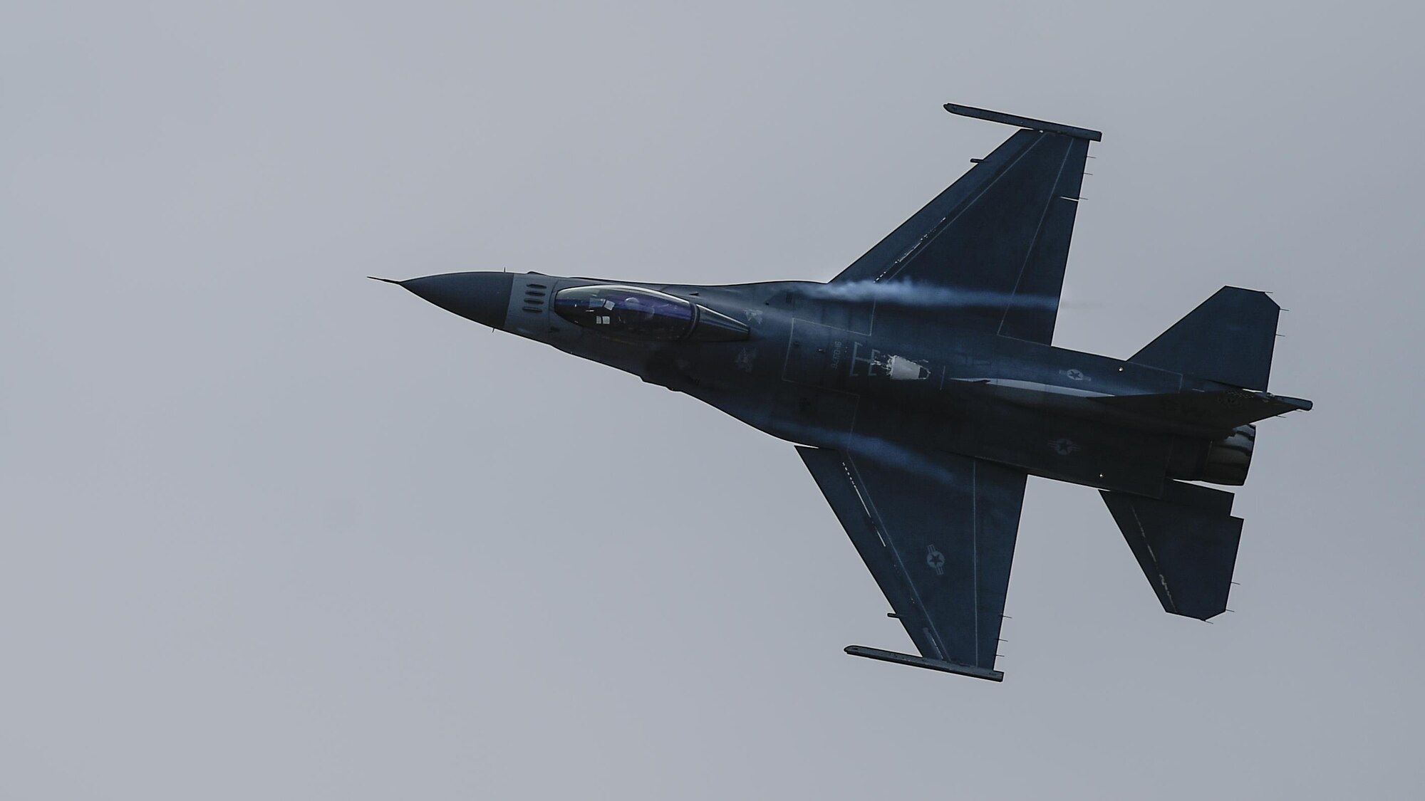 A U.S. Air Force F-16 Fighting Falcon performs a left bank during the 2017 Heritage Flight Training and Certification Course at Davis-Monthan Air Force Base, Ariz., Feb. 11, 2017. The F-16 is highly maneuverable and has proven itself in air-to-air combat and air-to-surface attack. It provides a relatively low-cost, high performance weapon system for the U.S. and its allied nations. (U.S. Air Force photo by Senior Airman Chris Drzazgowski)