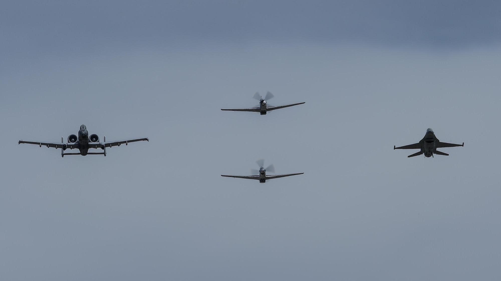 A U.S. Air Force A-10C Thunderbolt II, F-16 Fighting Falcon, a TF-51 and P-51 Mustang fly in formation during the 2017 Heritage Flight Training and Certification Course at Davis-Monthan Air Force Base, Ariz., Feb. 11, 2017. The 20th annual training event has been held at D-M since 2001 and features aerial demonstrations from historical and modern fighter aircraft. (U.S. Air Force photo by Senior Airman Chris Drzazgowski)