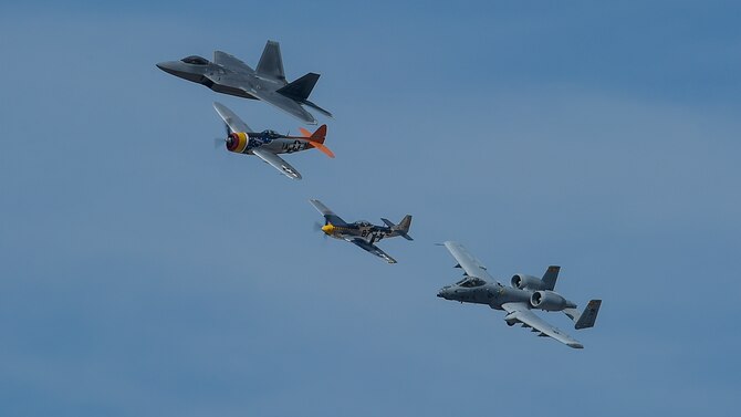 A U.S. Air Force F-22 Raptor, A-10C Thunderbolt II, a P-47 Thunderbolt and P-51 Mustang fly in formation during the 2017 Heritage Flight Training and Certification Course at Davis-Monthan Air Force Base, Ariz., Feb. 11, 2017. The 20th annual training event has been held at D-M since 2001 and features aerial demonstrations from historical and modern fighter aircraft. (U.S. Air Force photo by Senior Airman Chris Drzazgowski)