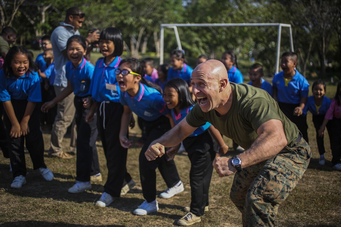 Marine Corps Master Sgt. Jeisson Manzifortich plays a game with students during Cobra Gold at the Juksamed School in Thailand, Feb. 8, 2017. The exercise focuses on supporting the humanitarian and medical needs of communities in the region. Marine Corps photo by Cpl. Wesley Timm