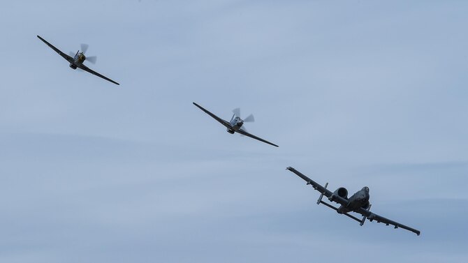 A U.S. Air Force A-10C Thunderbolt II and two P-51 Mustangs fly in formation during the 2017 Heritage Flight Training and Certification Course at Davis-Monthan Air Force Base, Ariz., Feb. 11, 2017. The 20th annual training event has been held at D-M since 2001 and features aerial demonstrations from historical and modern fighter aircraft. (U.S. Air Force photo by Senior Airman Chris Drzazgowski)