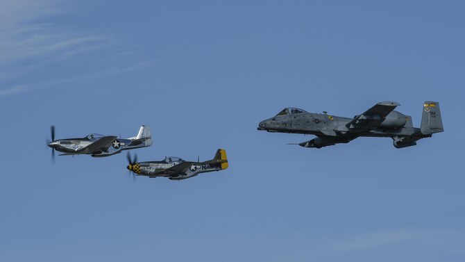 A U.S. Air Force A-10C Thunderbolt II and two P-51 Mustangs fly in formation during the 2017 Heritage Flight Training and Certification Course at Davis-Monthan Air Force Base, Ariz., Feb. 11, 2017. The 20th annual training event has been held at D-M since 2001 and features aerial demonstrations from historical and modern fighter aircraft. (U.S. Air Force photo by Senior Airman Chris Drzazgowski)