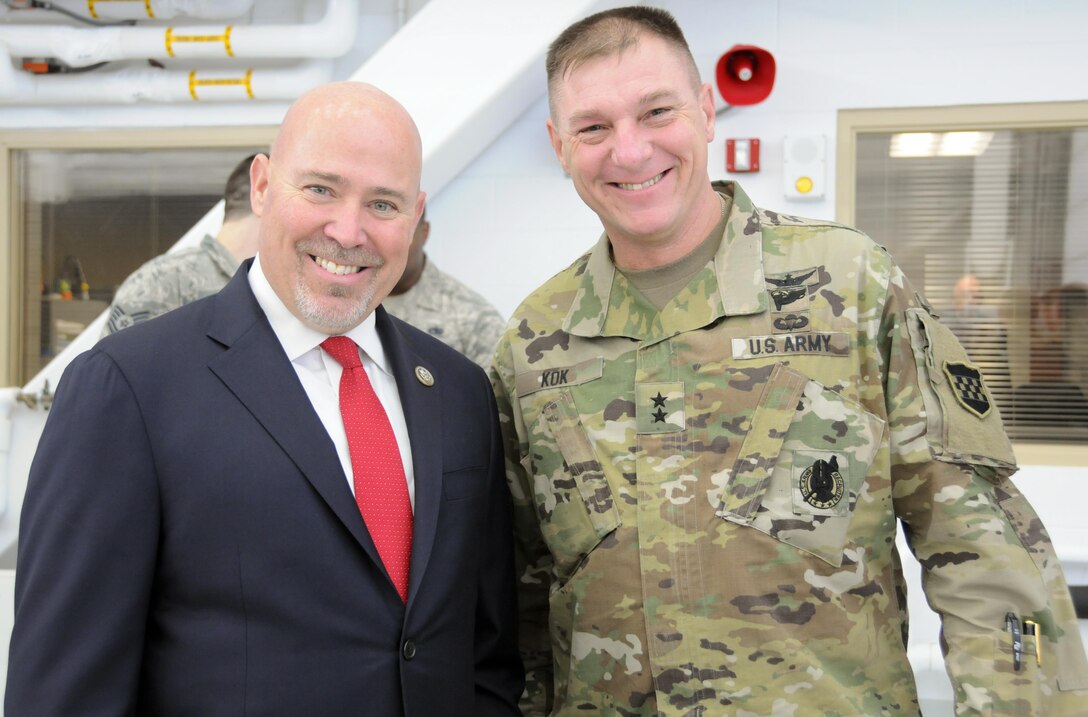 Maj. Gen. Troy D. Kok, commanding general of the U.S. Army Reserve’s 99th Regional Support Command, meets with U.S. Congressman Tom MacArthur, representative for New Jersey’s 3rd Congressional District, during a ribbon-cutting ceremony Feb. 10 for the new U.S. Army Communications-Electronics Research, Development and Engineering Center (CERDEC) Flight Activity facility on Joint Base McGuire-Dix-Lakehurst, New Jersey. This new facility significantly enhances CERDEC’s ability to provide superior communications-electronics solutions for aviation platforms that enable the Army to fight and win across multiple operational domains.