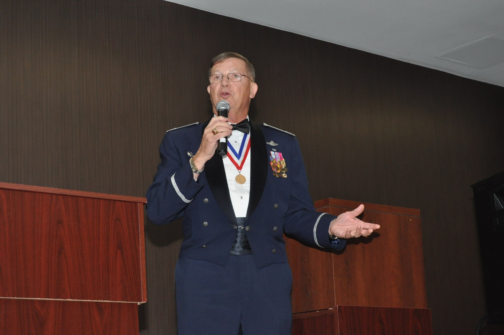 Retired Air Force ACE Col. Chuck Debellevue, the highest-scoring Ace of the Vietnam War, speaks to an audience of more than 400 members and guests of the 433rd Airlift Wing during the wing’s Annual Awards Banquet held at the Courtyard SeaWorld San Antonio Feb. 11, 2017. Debellevue shared his examples of teamwork, excellence, and leadership which helped him achieve ACE status in Vietnam. (U.S. Air Force photo/Senior Airman Bryan Swink)