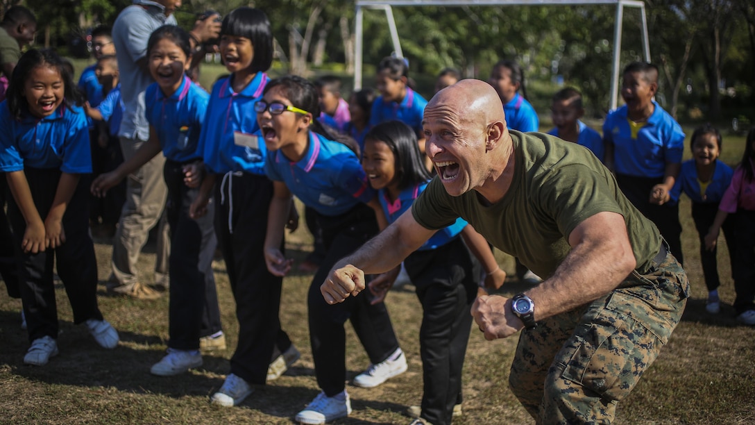 Marine Corps Master Sgt. Jeisson Manzifortich plays a game with students during Cobra Gold at the Juksamed School in Thailand, Feb. 8, 2017. The exercise focuses on supporting the humanitarian and medical needs of communities in the region. Marine Corps photo by Cpl. Wesley Timm