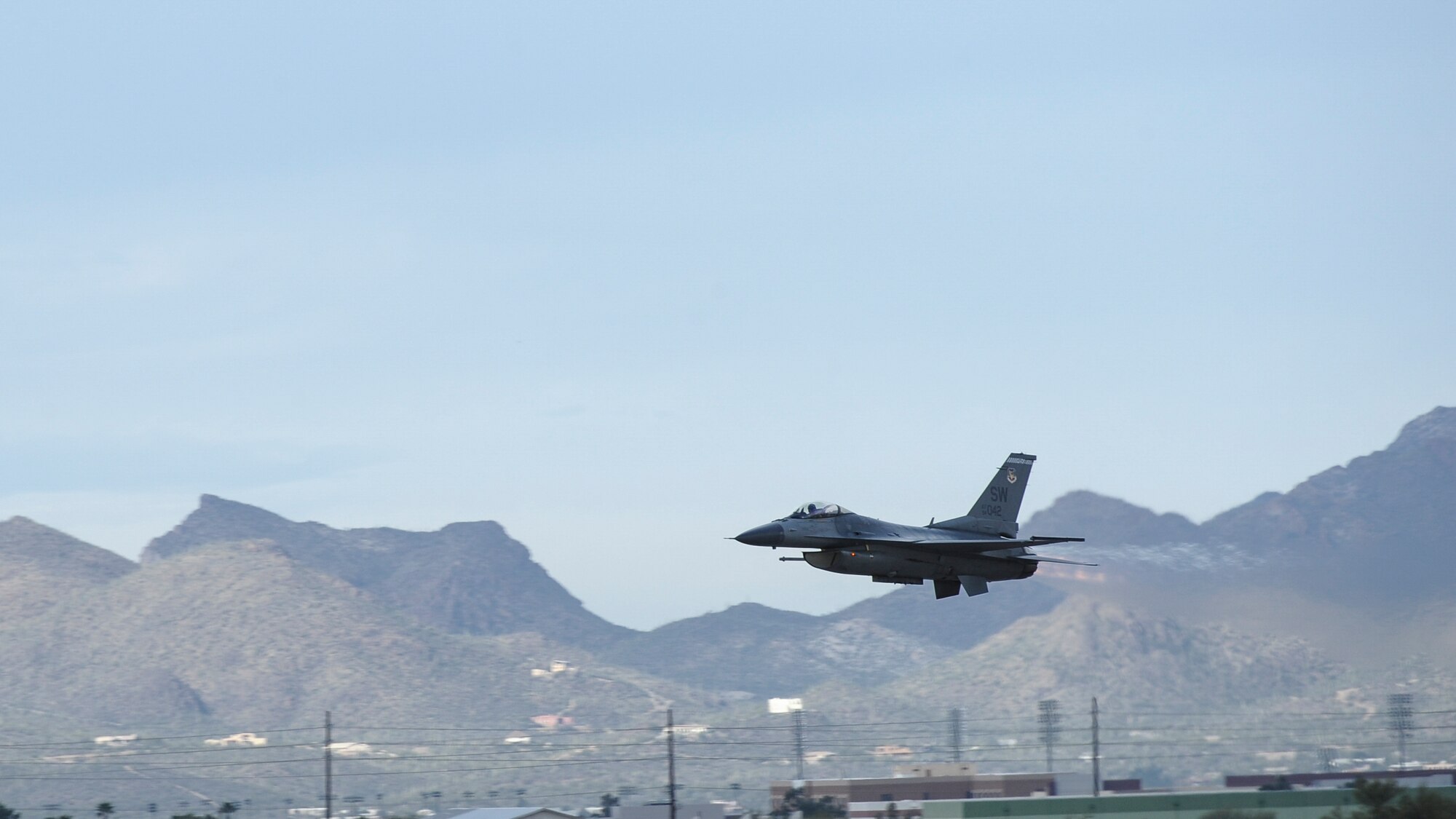 A U.S. Air Force F-16C Fighting Falcon takes off during the 2017 Heritage Flight Training and Certification Course at Davis-Monthan Air Force Base, Ariz., Feb. 12, 2017. The modern aircraft that participated in this year's HFTCC were the F-35 Lightning II, the F-22 Raptor, the F-16 Fighting Falcon and the A-10C Thunderbolt II. (U.S. Air Force photo by Airman 1st Class Mya M. Crosby)