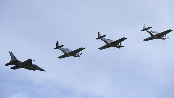 A U.S. Air Force F-16C Fighting Falcon, two P-51 Mustangs and a TF-51 Mustang fly in formation during the 2017 Heritage Flight Training and Certification Course at Davis-Monthan Air Force Base, Ariz., Feb. 12, 2017. The historic aircraft included the P-51 and T-51 Mustangs, the P-40 Warhawk, the P-38 Lightning, the P-47 Thunderbolt, the T-33 Shooting Star and the F-86 Sabre. (U.S. Air Force photo by Airman 1st Class Mya M. Crosby)