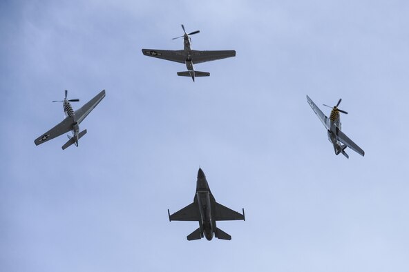 A U.S. Air Force F-16C Fighting Falcon, two P-51 Mustangs and a TF-51 Mustang fly in formation during the 2017 Heritage Flight Training and Certification Course at Davis-Monthan Air Force Base, Ariz., Feb. 12, 2017. The annual aerial demonstration training event has been held at D-M since 2001. (U.S. Air Force photo by Airman 1st Class Mya M. Crosby)