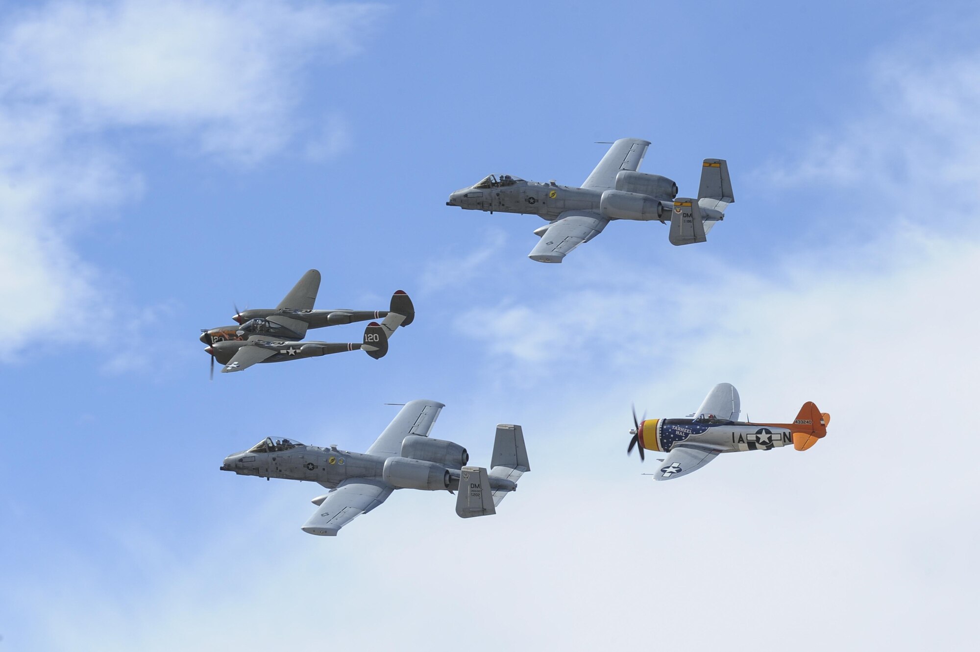 Two U.S. Air Force A-10C Thunderbolt IIs, a P-38 Lightning and a P-47 Thunderbolt fly in formation during the 2017 Heritage Flight Training and Certification Course at Davis-Monthan Air Force Base, Ariz., Feb. 12, 2017. The modern aircraft that participated in this year's HFTCC were the F-35 Lightning II, the F-22 Raptor, F-16 Fighting Falcon and the A-10C Thunderbolt II. (U.S. Air Force photo by Airman 1st Class Mya M. Crosby)