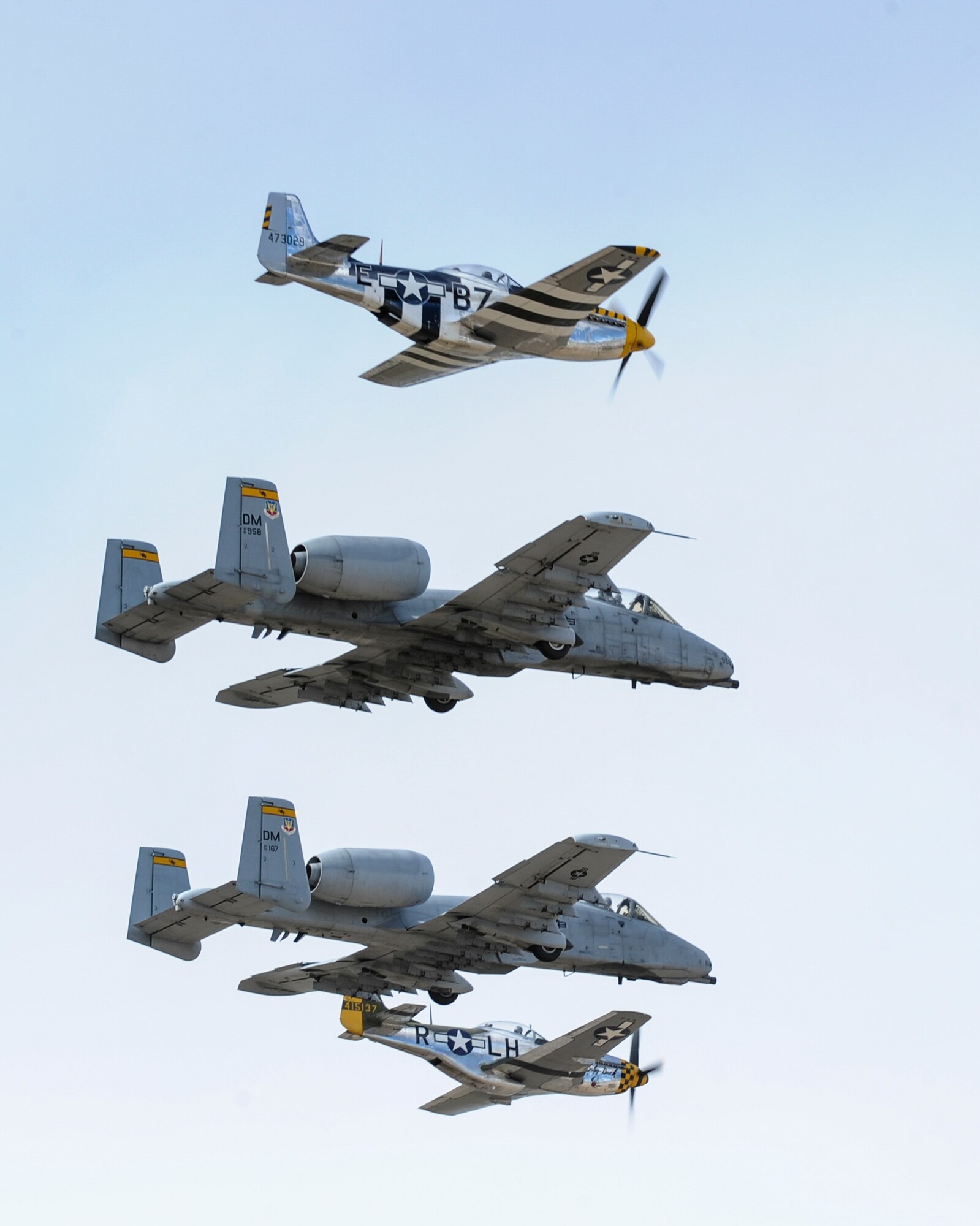 Two U.S. Air Force A-10C Thunderbolt IIs and two P-51 Mustangs fly in formation during the 2017 Heritage Flight Training and Certification Course at Davis-Monthan Air Force Base, Ariz., Feb. 12, 2017. The modern aircraft that participated in this year's HFTCC were the F-35 Lightning II, the F-22 Raptor, F-16 Fighting Falcon and the A-10C Thunderbolt II. (U.S. Air Force photo by Airman 1st Class Mya M. Crosby)