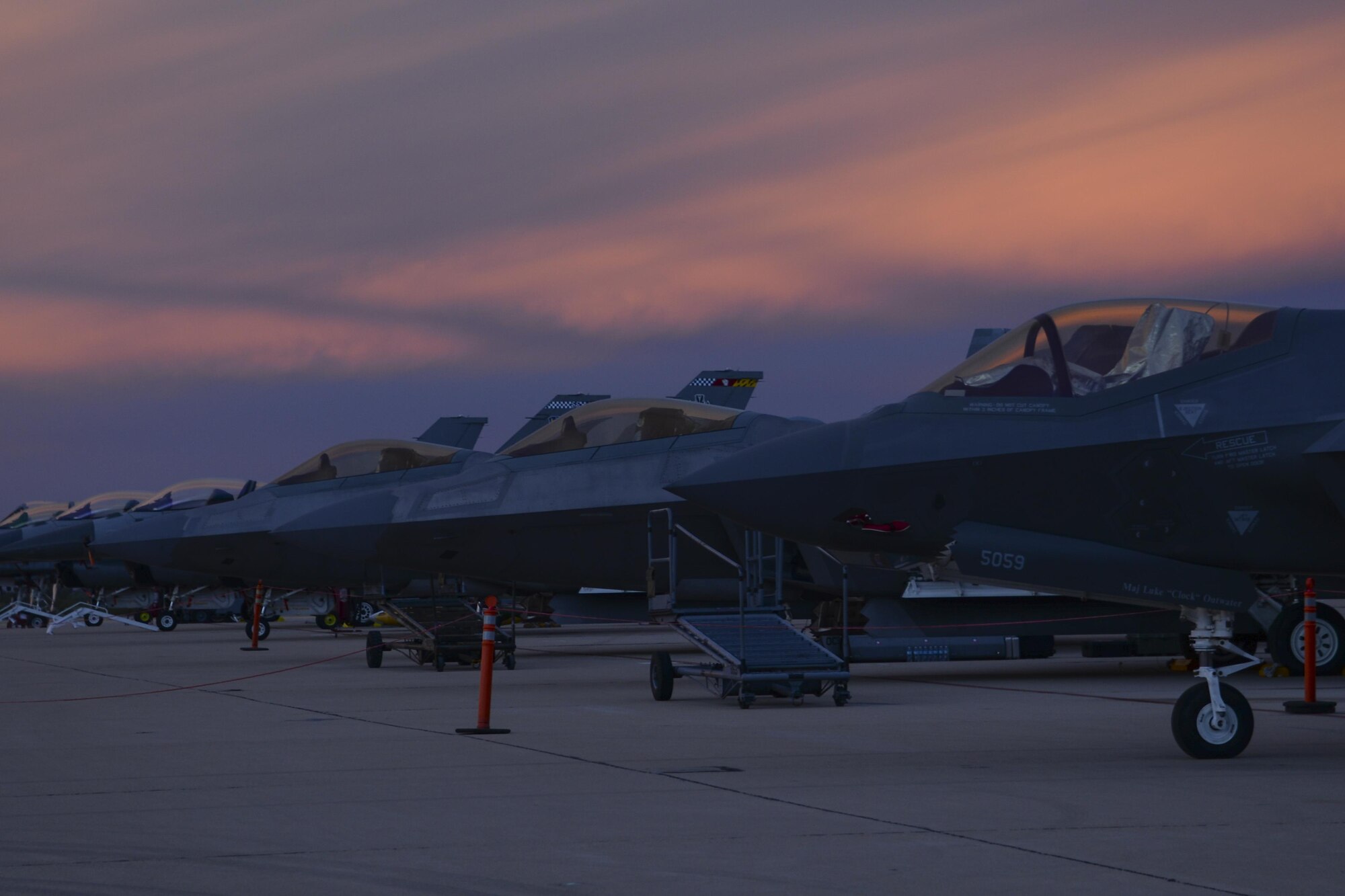 A U.S. Air Force F-35 Lightning II, two F-22 Raptors and two F-16 Fighting Falcons rests on the flightline during the 2017 Heritage Flight Training and Certification Course at Davis-Monthan Air Force Base, Ariz., Feb. 12, 2017. Established in 1997, the HFTCC certifies civilian pilots of historic military aircraft and U.S. Air Force pilots to fly in formation together during the upcoming air show season. (U.S. Air Force photo by Senior Airman Ashley N. Steffen)