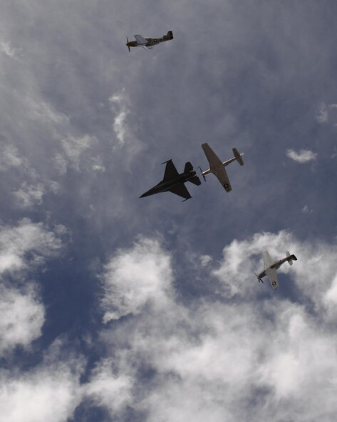 A U.S. Air Force F-16 Fighting Falcon, a TF-51 Mustang and two P-51 Mustangs fly in formation during the 2017 Heritage Flight Training and Certification Course at Davis-Monthan Air Force Base, Ariz., Feb. 12, 2017. The modern aircraft that participated in this year's HFTCC were the F-35 Lightning II, the F-22 Raptor, F-16 Fighting Falcon and the A-10C Thunderbolt II. The historic aircraft included the P-51 and T-51 Mustangs, the P-40 Warhawk, the P-38 Lightning, the P-47 Thunderbolt, the T-33 Shooting Star and the F-86 Sabre. (U.S. Air Force photo by Senior Airman Ashley N. Steffen)