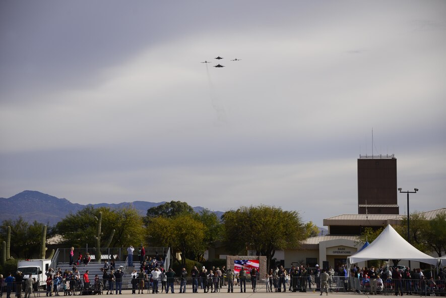 A U.S. Air Force F-22 Raptor, a F-35 Lightning II and two F-86 Sabre's fly in formation over viewers during the 2017 Heritage Flight Training and Certification Course at Davis-Monthan Air Force Base, Ariz., Feb. 12, 2017. The modern aircraft that participated in this year’s HFTCC were the F-35 Lightning II, the F-22 Raptor, F-16 Fighting Falcon and the A-10C Thunderbolt II. The historic aircraft included the P-51 and T-51 Mustangs, the P-40 Warhawk, the P-38 Lightning, the P-47 Thunderbolt, the T-33 Shooting Star and the F-86 Sabre. (U.S. Air Force photo by Senior Airman Betty R. Chevalier)