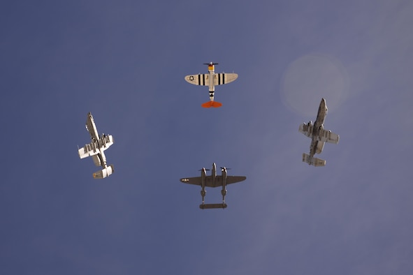 Two U.S. Air Force A-10C Thunderbolt II's, a P-38 Lightning and a P-47 Thunderbolt break out of a formation during the 2017 Heritage Flight Training and Certification Course at Davis-Monthan Air Force Base, Ariz., Feb. 12, 2017. The annual aerial demonstration training event has been held at D-M since 2001. The course featured aerial demonstrations from historic and modern fighter aircraft. (U.S. Air Force photo by Senior Airman Betty R. Chevalier)