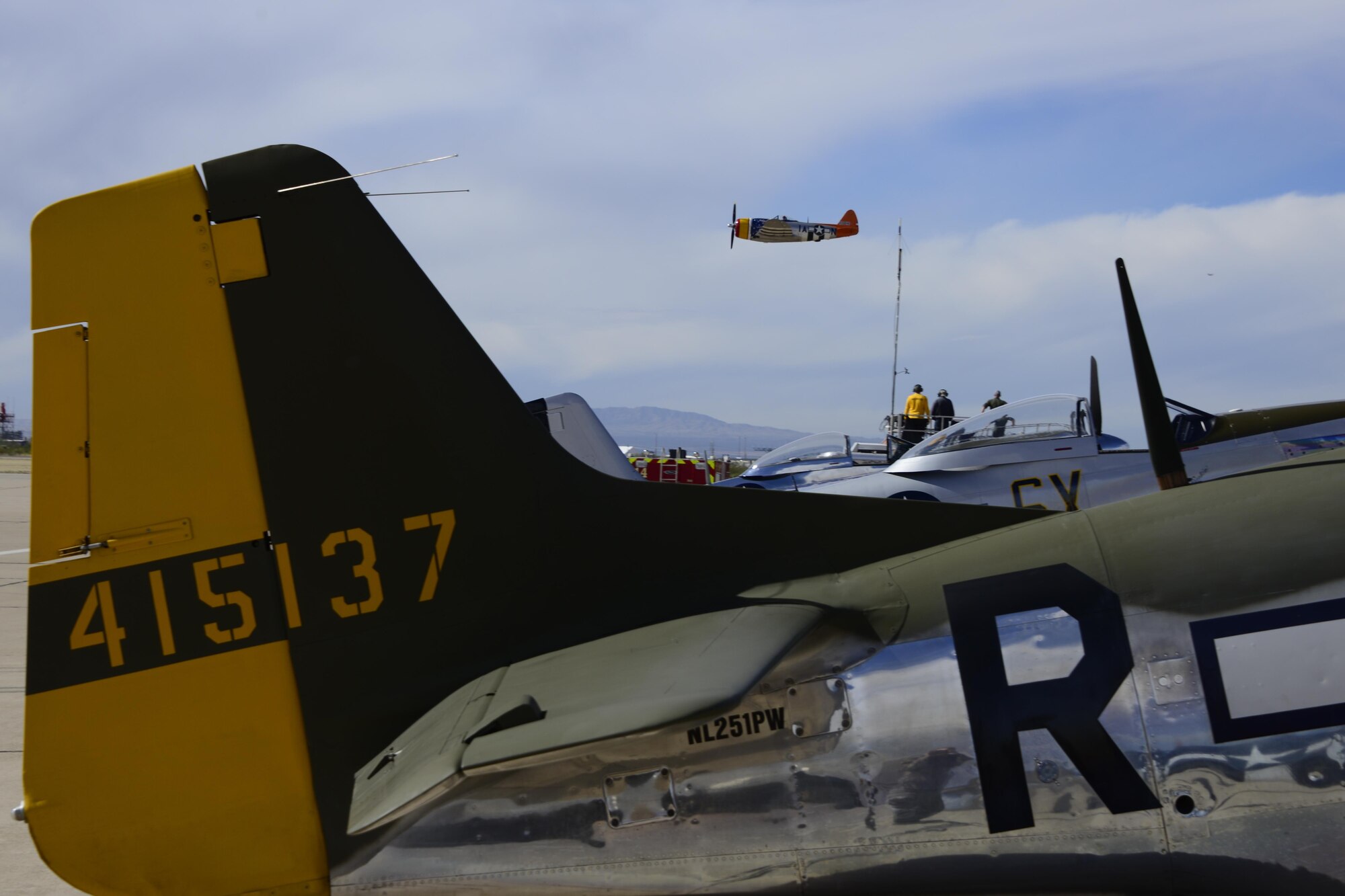 A P-47 Thunderbolt performs a fly by during the 2017 Heritage Flight Training and Certification Course at Davis-Monthan Air Force Base, Ariz., Feb. 12, 2017. The HFTCC provides civilian and military pilots the opportunity to practice flying in formation together in preparation for future air shows. (U.S. Air Force photo by Senior Airman Betty R. Chevalier)