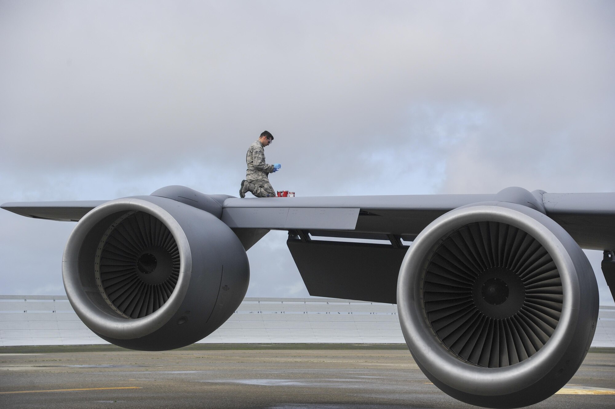 Senior Airman Robert Carson III, 940th Aircraft Maintenance Squadron crew chief, works on the hydraulic system Feb. 10, 2017, at Beale Air Force Base, California. Members from the 940 AMXS, as well as the 940th Operations Group, participated in generation training with four KC-135 Stratotankers. (U.S. Air Force photo by Senior Airman Tara R. Abrahams)