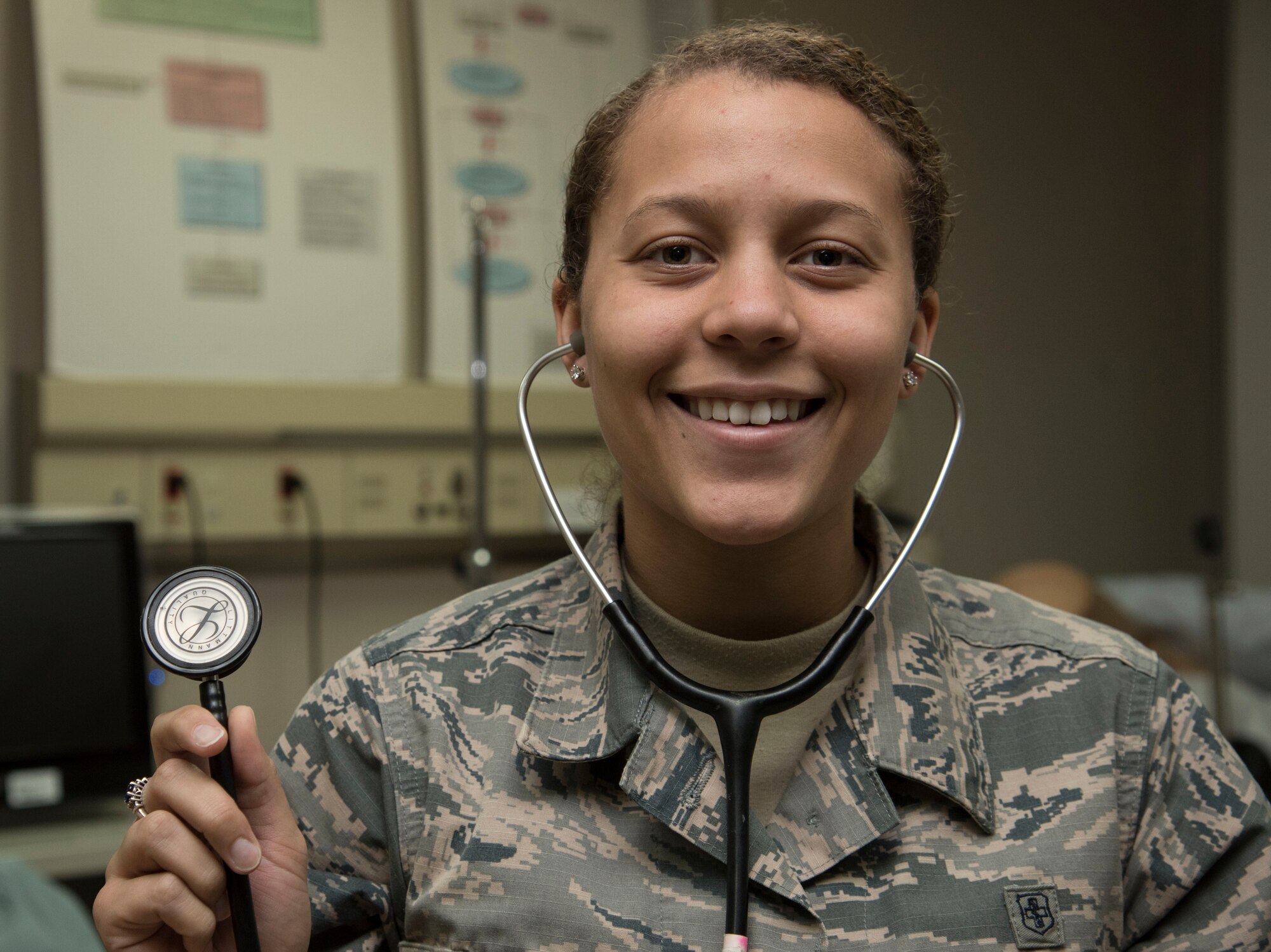 U.S. Air Force Airman 1st Class Dominique Case, a 35th Medical Operations Squadron aerospace medical technician, holds a stethoscope at Misawa Air Base, Japan, Feb. 3, 2017. One Friday a month, the 35th Medical Group closes down and holds a training to hone their life-saving skills. (U.S. Air Force photo by Airman 1st Class Sadie Colbert)