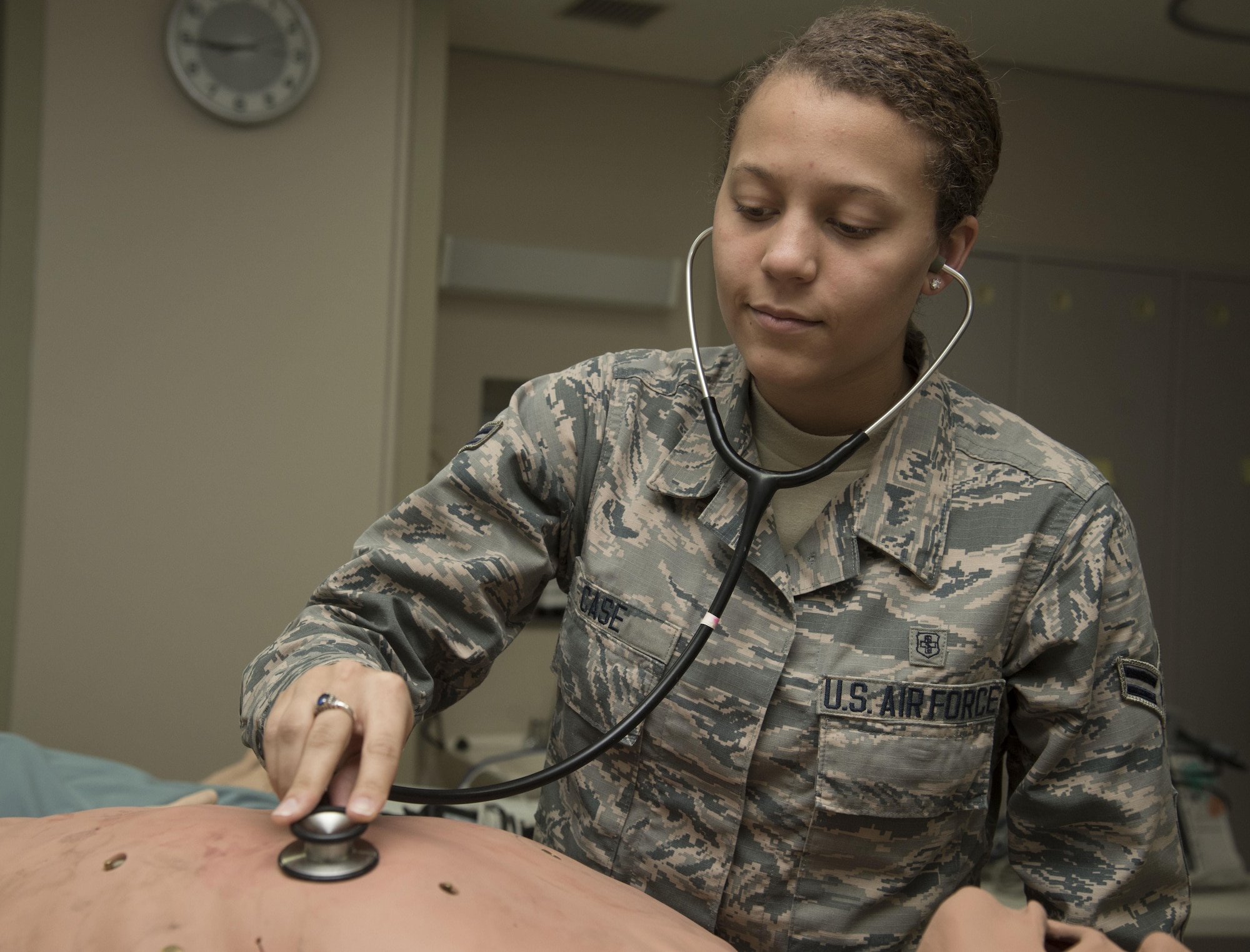 U.S. Air Force Airman 1st Class Dominique Case, a 35th Medical Operations Squadron aerospace medical technician, uses a stethoscope to listen to a mannequin’s heartbeat at Misawa Air Base, Japan, Feb. 3, 2017. The training focused on responding to a collapsed patient with an automated external defibrillator. (U.S Air Force photo by Airman 1st Class Sadie Colbert)