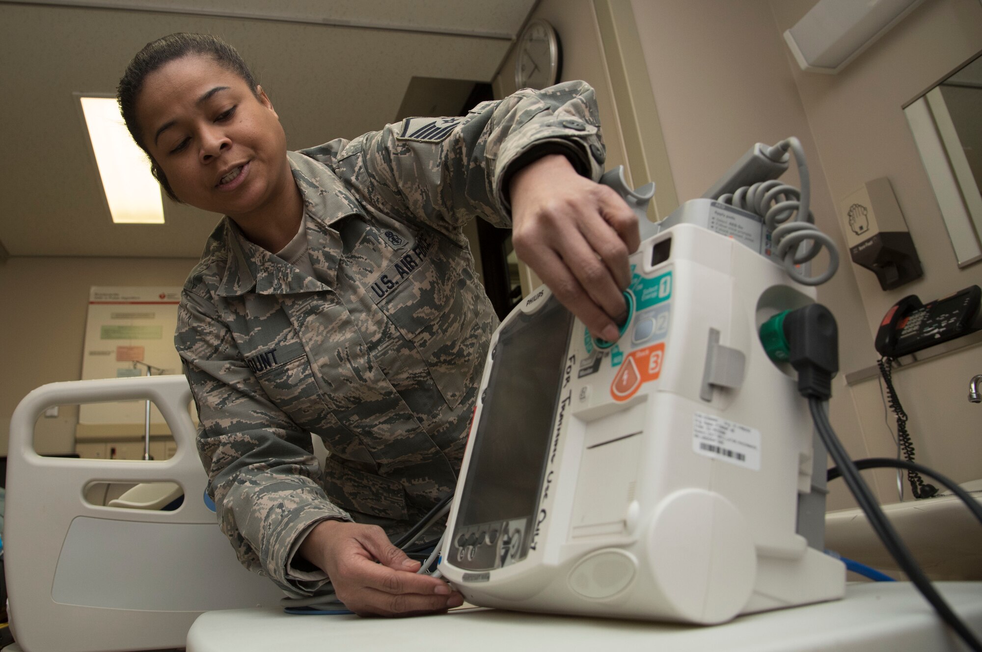 U.S. Air Force Master Sgt. Charlene Blunt, the 35th Medical Group education and training flight chief, powers on a Philips HeartStart MRx defibrillator and heart monitor during training at Misawa Air Base, Japan, Feb. 3, 2017. According to Blunt any personnel who come into physical contact with patients are required to know how to use all types of automated external defibrillator machines and know the basics of CPR. (U.S. Air Force photo by Airman 1st Class Sadie Colbert)