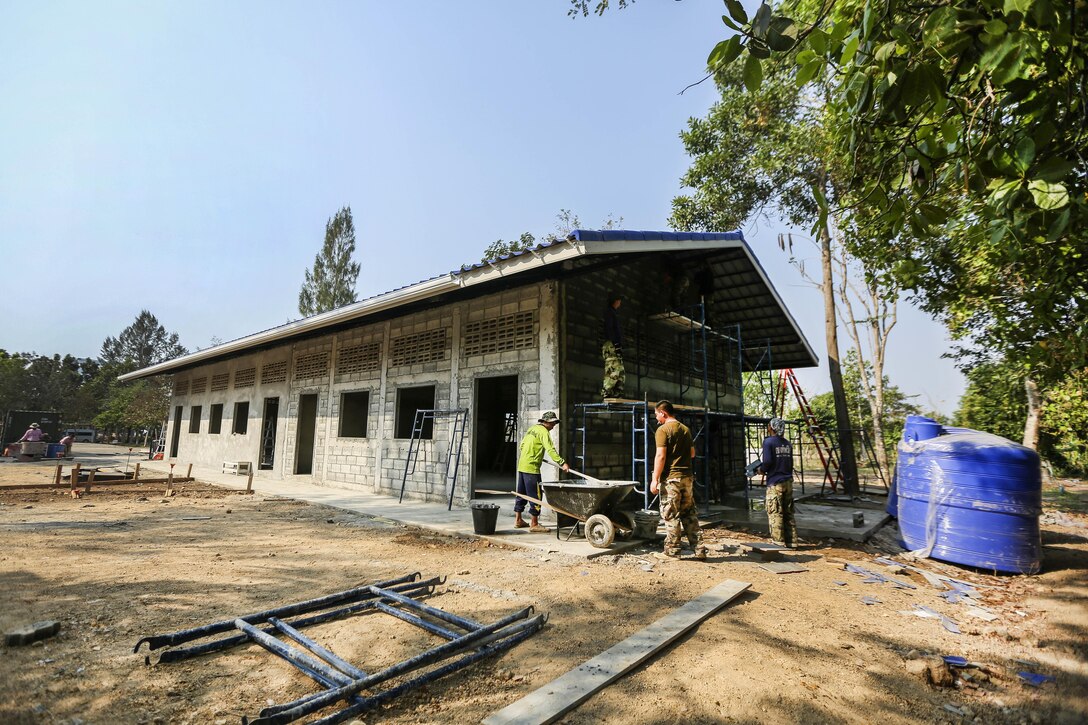 Thai and U.S. sailors build a classroom during exercise Cobra Gold at Ban Nong Muang School, Rayong Province, Thailand, Feb. 10, 2017. Marine Corps photo by Cpl. Wesley Timm 