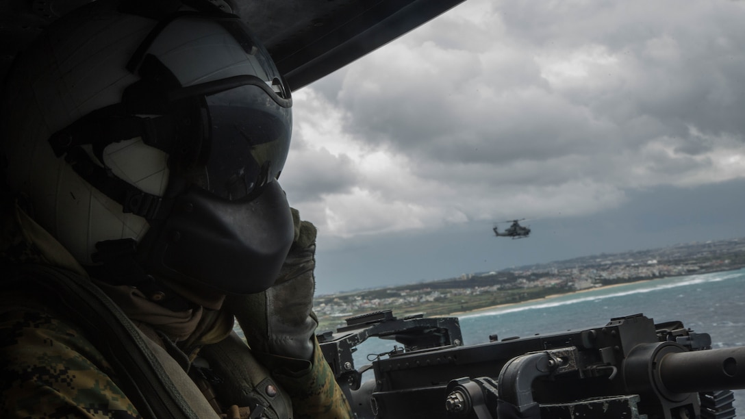 U.S. Marine Corps Lance Cpl. Servando Avila, a crew chief with Marine Light Attack Helicopter Squadron 267, 3rd Marine Aircraft Wing, participates in a Tactical Air Control Party off the coast of Okinawa February 9, 2017. This specific training focused on enhancing efficiency and coordination between air and ground elements, which is crucial to maintain a stronger, more capable forward deployed force of readiness in support of the U.S.-Japan alliance and our regional partners. 