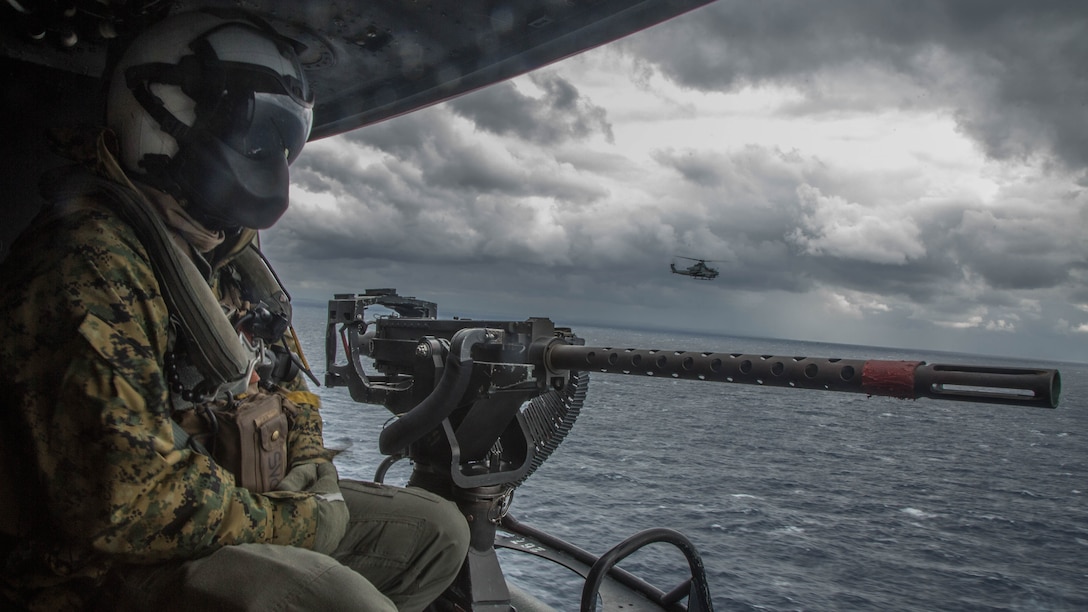 U.S. Marine Corps Lance Cpl. Servando Avila, a crew chief with Marine Light Attack Helicopter Squadron 267, 3rd Marine Aircraft Wing, participates in a Tactical Air Control Party off the coast of Okinawa February 9, 2017. This specific training focused on enhancing efficiency and coordination between air and ground elements, which is crucial to maintain a stronger, more capable forward deployed force of readiness in support of the U.S.-Japan alliance and our regional partners. 