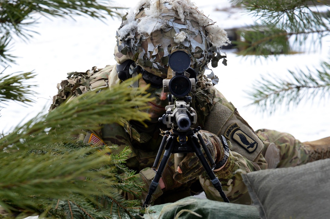 A soldier scans his sector while providing security during a live-fire exercise at Grafenwoehr Training Area, Germany, Feb. 6, 2017. Army photo by Matthias Fruth