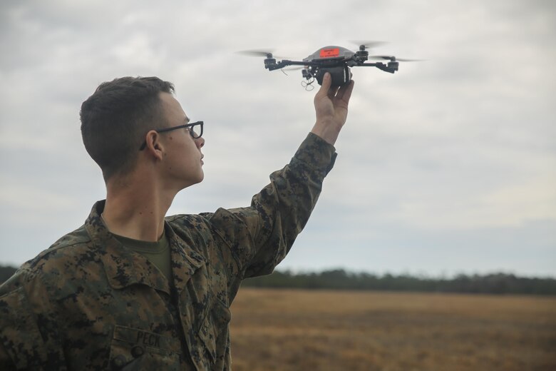 A Marine with Task Force Southwest prepares to launch the Instant Eye small unmanned aerial system at Camp Lejeune, N.C., Feb. 8, 2017. Due to its compact size, the Instant Eye will allow Marines to capture imagery and conduct reconnaissance in buildings and other confined areas. Task Force Southwest is comprised of approximately 300 Marines, whose mission will be to train, advise and assist the Afghan National Army 215th Corps and 505th Zone National Police. (U.S. Marine Corps photo by Sgt. Lucas Hopkins)