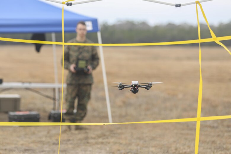 A Marine with Task Force Southwest flies the Instant Eye small unmanned aerial system through an obstacle at Camp Lejeune, N.C., Feb. 8, 2017. Unlike larger drones, the Instant Eye can maneuver in tightly confined spaces, such as buildings and around corners, to record surveillance and conduct reconnaissance. Task Force Southwest is comprised of approximately 300 Marines, whose mission will be to train, advise and assist the Afghan National Army 215th Corps and 505th Zone National Police. (U.S. Marine Corps photo by Sgt. Lucas Hopkins)