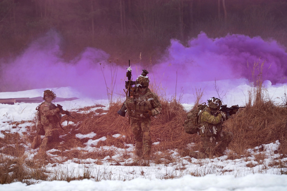A recon team of soldiers move under smoke cover during a live-fire exercise at Grafenwoehr Training Area, Germany, Feb. 6, 2017. Army photo by Gerhard Seuffert